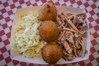 Eating American (Traditional) Barbeque Chicken at Little Pigs BBQ restaurant in Asheville, NC.